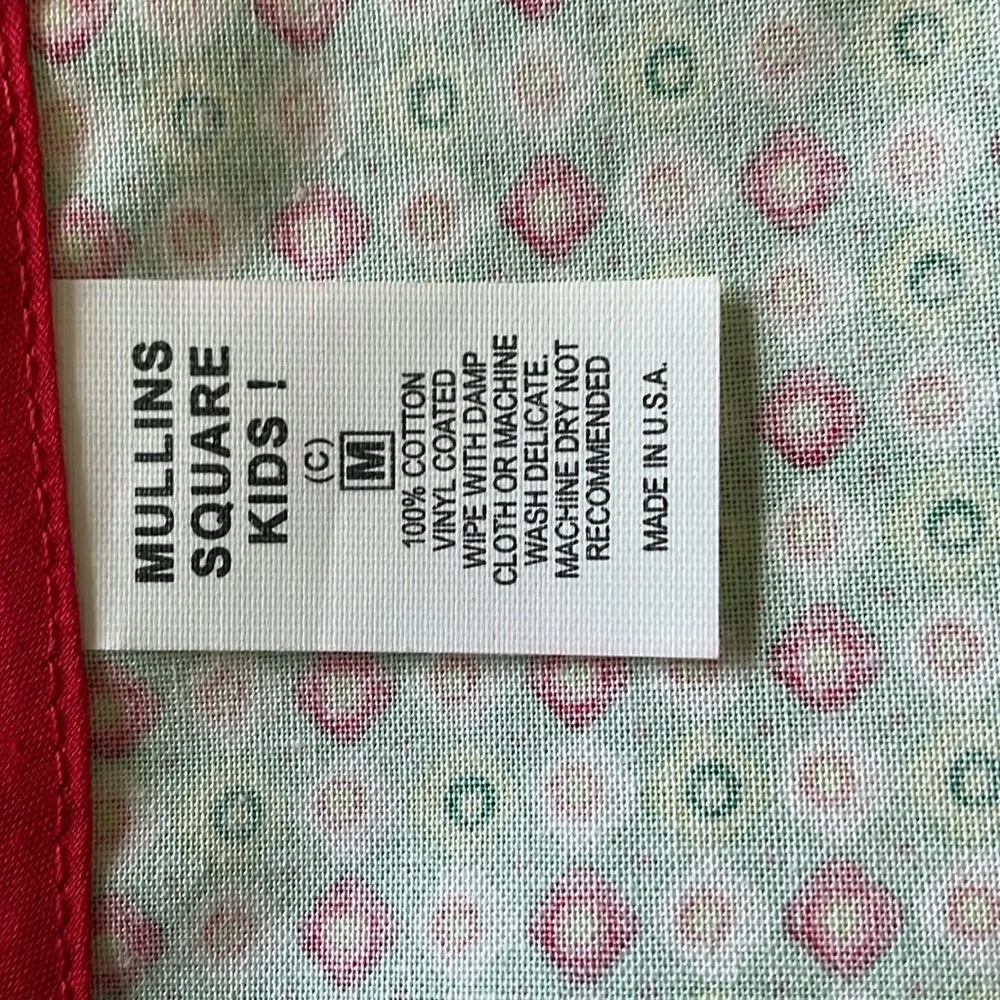 Baby bib with plastic coating on front